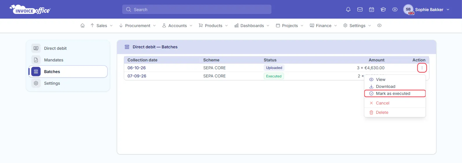 The Direct debit Batches list in Invoice Office with an Uploaded SEPA CORE batch for 06-10-26 of 3 × €4,630.00 and an Executed batch for 07-09-26; the Action menu of the first batch is open with View, Download, Mark as executed, Cancel and Delete, and Mark as executed is outlined in red
